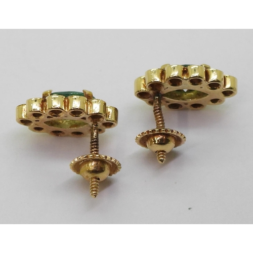 777 - A pair of bright yellow metal emerald and diamond stud earrings with secure threaded posts, weight 2... 