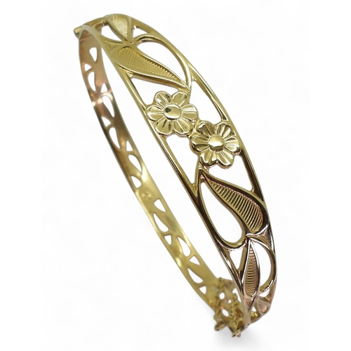 797 - A 9ct gold flower design bangle, weight 9.7gms