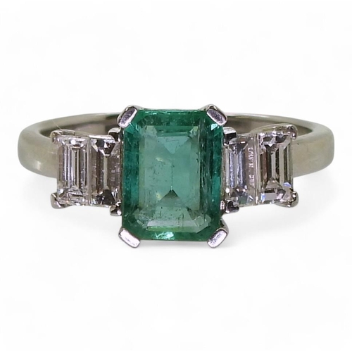 798 - An 18ct white gold classic step cut emerald and baguette cut diamond ring, the emerald measures 7.9m... 