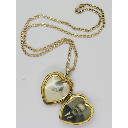 805 - A 9ct gold heart shaped 'Back & Front' locket engraved with love birds and flowers, length with ... 