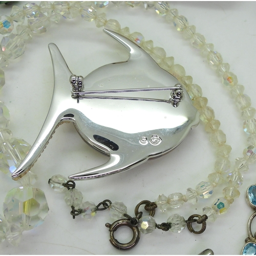 887 - A silver 'stork bird' shaped toothpick, a Swarovski Sun Fish brooch, a silver labradorite, opalite a... 