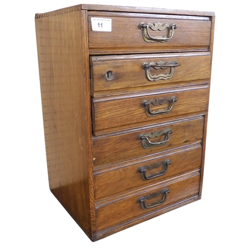 11 - A small 20th century oak six drawer chest, 46cm high x 32cm wide x 27cm deep