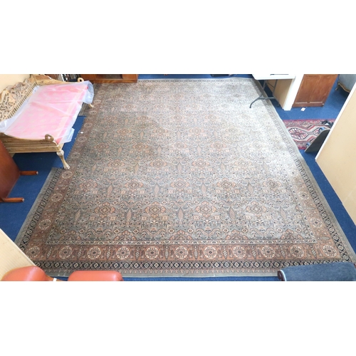 125 - A large light green coloured ground Moud style carpet with all over geometric foliate design within ... 