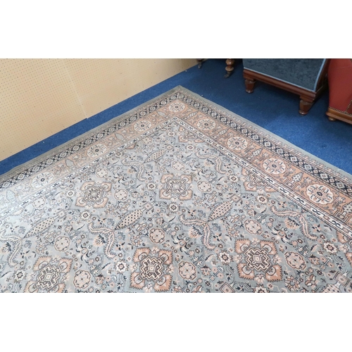 125 - A large light green coloured ground Moud style carpet with all over geometric foliate design within ... 