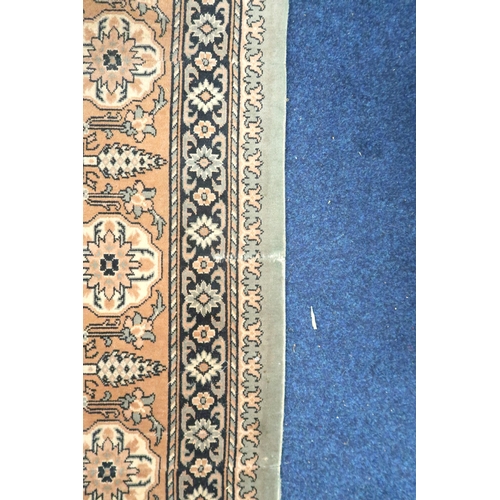 125 - A large light green coloured ground Moud style carpet with all over geometric foliate design within ... 