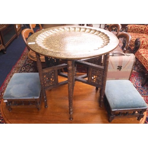 127 - A lot comprising a Moorish style brass topped table with carved pierced folding base, pair of small ... 