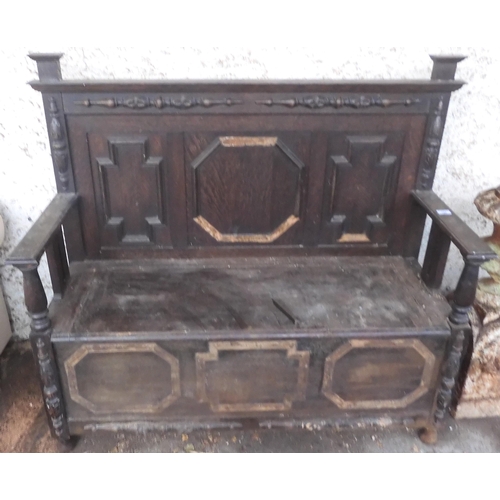 128 - A 20th century oak Jacobean style hall settle (def), 114cm high x 129cm wide x 48cm deep