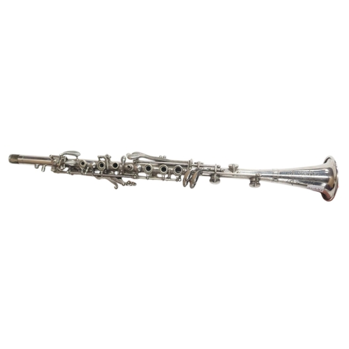 604 - A Reid's Metal Clarinet with hard shell case, made in the USA, serial. B6491, also collection of win... 