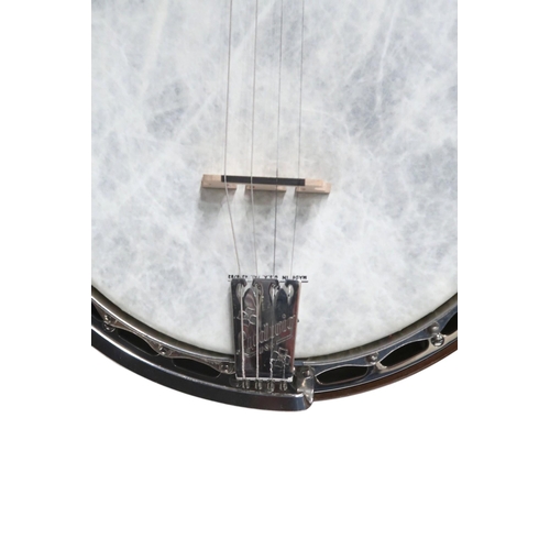 620 - A Ludwig Dixie nineteen fret tenor banjo, made c.1930's in the U.S.A, with golden glitter inlay to t... 