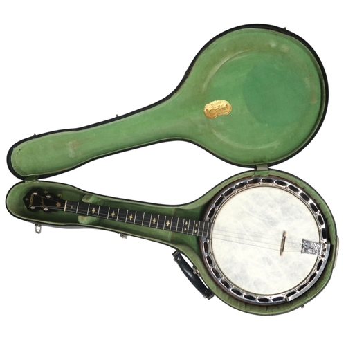 620 - A Ludwig Dixie nineteen fret tenor banjo, made c.1930's in the U.S.A, with golden glitter inlay to t... 