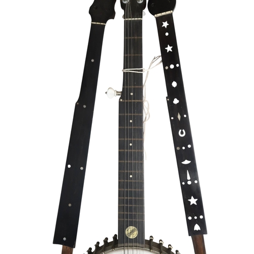 621 - W.T.B. Sterling seven-string banjo, late 19th century, with an open back and conventional dot inlay.... 