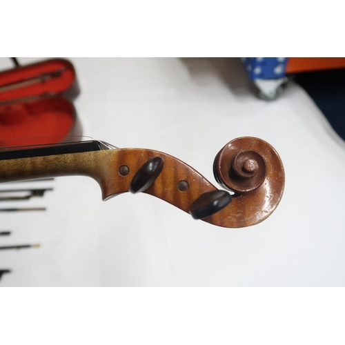 622 - A two piece back violin by Nicola Genari, labelled to the interior with 1911, back length is 36cm. T... 