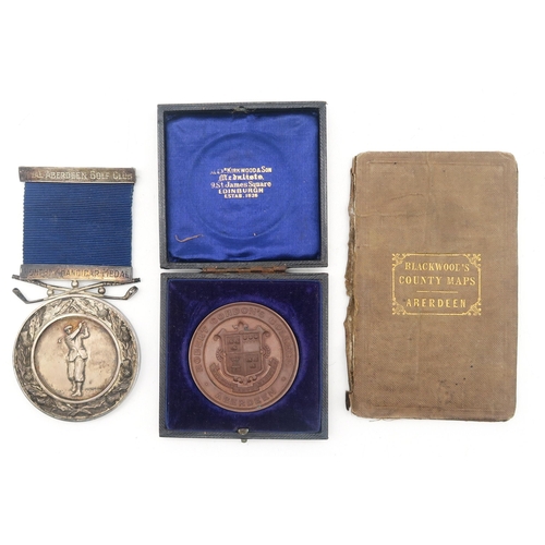 A silver Royal Aberdeen Golf Club Monthly Handicap Medal by James Fenton, Birmingham, 1948, engraved verso "Finally Won by A.M.S. Stewart 93+94=87-36=151", with names of former recipients engraved centrally, total weight (inclusive of ribbon) 76.5g; together with a cased bronze Robert Gordon's College Dux medal, awarded to Alex. M. Stewart;  and a folding Blackwood's  pocket County Map of Aberdeen (3)