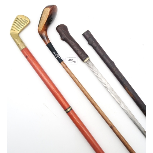 466 - A swagger stick, the scabbard and grip with imitation bark cladding a brass shell casing ferrule, th... 