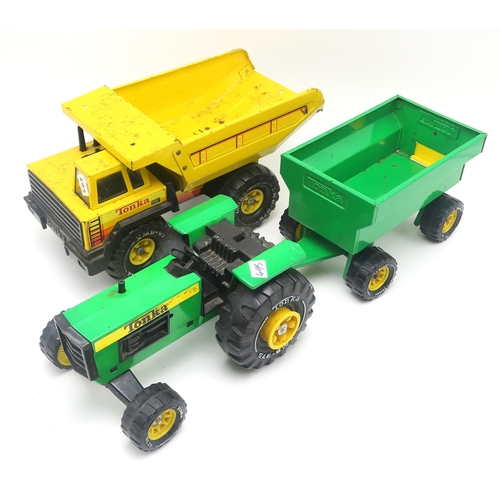 495 - Six various Tonka Trucks, comprising a tractor and trailer, cement mixer, bulldozer, crane etc.