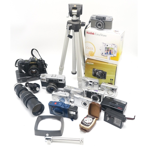 503 - A large quantity of camera equipment, to include a Canon A-1 camera fitted with an FD 50mm 1:1.8 len... 