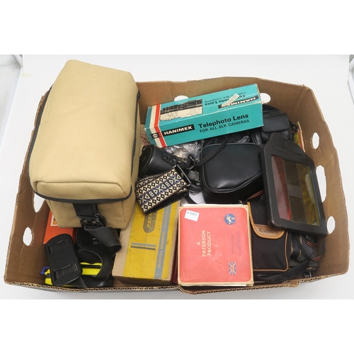 503 - A large quantity of camera equipment, to include a Canon A-1 camera fitted with an FD 50mm 1:1.8 len... 