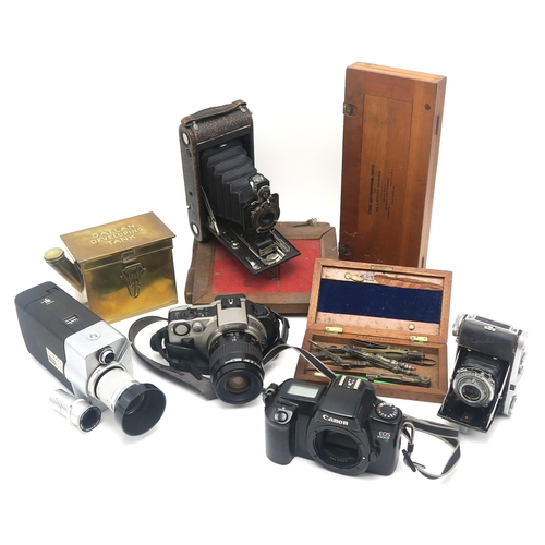 504 - Cameras and related equipment, to include a Canon Eos IX camera fitted with an EF 35-80mm Zoom lens,... 