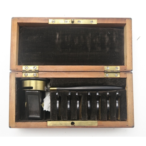 505 - A lacquered brass microscope by J. Lizars of Glasgow, housed in a mahogany travel case; with a quant... 