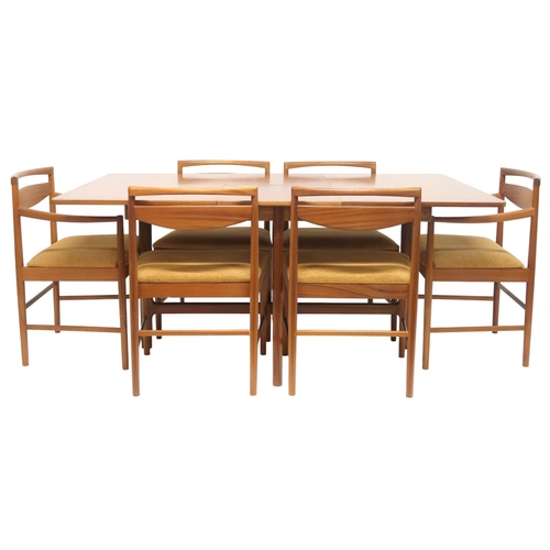 95 - A MID 20TH CENTURY TEAK A.H MCINTOSH & CO LTD OF KIRKCALDY TEAK EXTENDING DINING TABLE AND SIX C... 