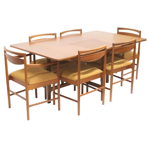 95 - A MID 20TH CENTURY TEAK A.H MCINTOSH & CO LTD OF KIRKCALDY TEAK EXTENDING DINING TABLE AND SIX C... 