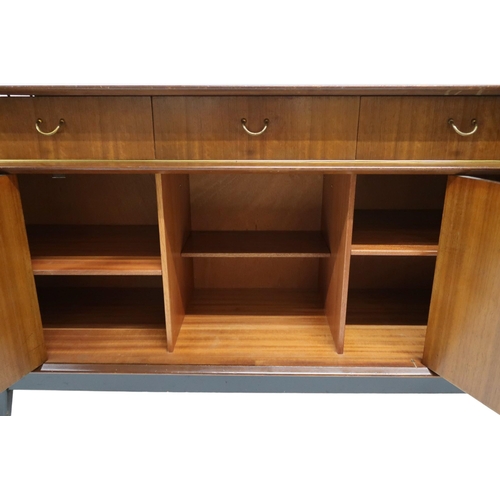 97 - A MID 20TH CENTURY G PLAN E-GOMME LIBRENZA DINING SUITEComprising Tola sideboard with three short dr... 