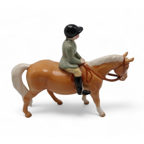 211 - A Beswick boy on pony