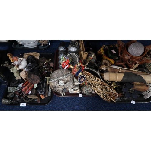 238 - Assorted metalware, ethnic figures, decorated model skulls etc