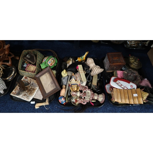 238 - Assorted metalware, ethnic figures, decorated model skulls etc