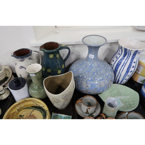 245 - A collection of glazed studio pottery including jugs, bowls, vases etc