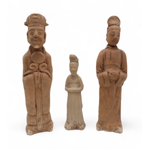 266 - Three Chinese tomb pottery figures, one in the Sui dynasty style, a carved Buddhist statue, another ... 