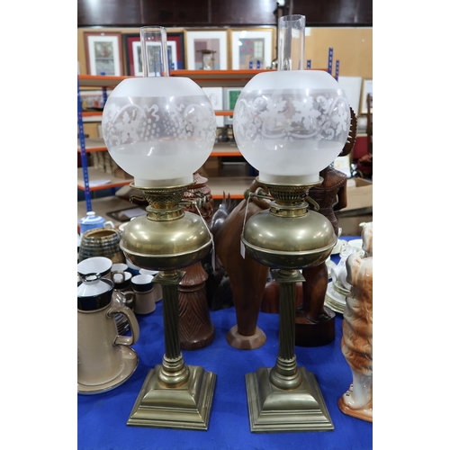 291 - A pair of brass oil lamps with etched shades and Young's Duplex wheels