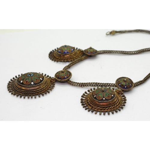 2703 - A SCANDINAVIAN TRADITIONAL NECKLACEmade in gilded white metal (stamped 830) decorated with cloisonne... 