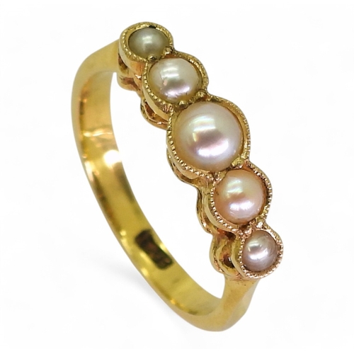 2705 - A VINTAGE PEARL RINGmade in 18ct gold the scallop galleried mount holds five split pearls. Finger si... 