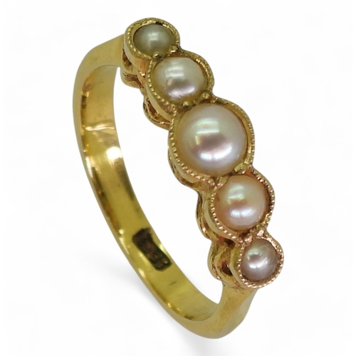 2705 - A VINTAGE PEARL RINGmade in 18ct gold the scallop galleried mount holds five split pearls. Finger si... 