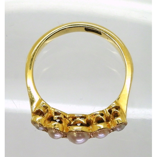 2705 - A VINTAGE PEARL RINGmade in 18ct gold the scallop galleried mount holds five split pearls. Finger si... 