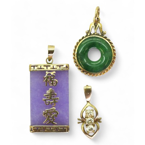 767 - A Chinese green hardstone rondel pendant mounted in yellow metal, together with a 9ct gold mounted p... 