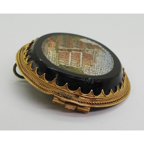 2719 - A MICRO MOSAIC BROOCHdepicting the Colosseum, in a yellow metal brooch mount, the pin is stamped wit... 