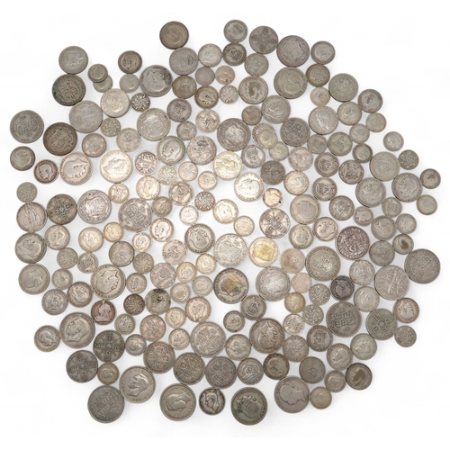 452 - Great Britain a coin collection to include pre 1947 silver coins with an approximate weight of 1200 ... 