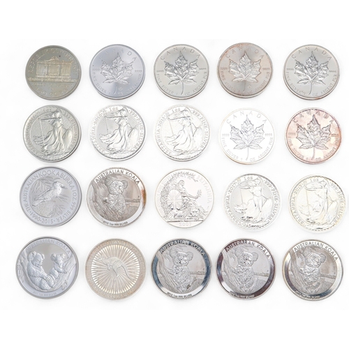 456 - A lot comprising various silver 1oz coins to include Liberty Dollars, Britannia Crowns etc (29)