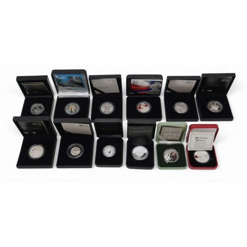 351 - A lot comprising twelve 1 oz silver commemorative coins approximate weight 330 grams