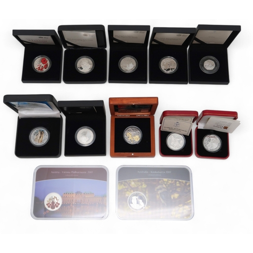 354 - A lot comprising twelve 1 oz silver commemorative coins approximate weight 330 grams