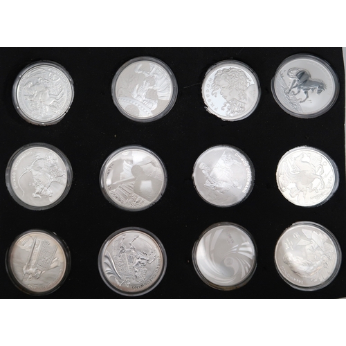 355 - A lot comprising 24 1 oz silver coins various designers cased