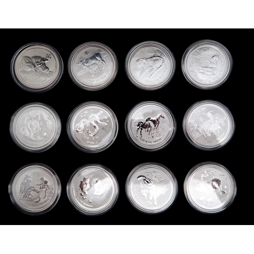 379 - Various Chinese zodiac silver coins with three collector's cases approximate weight 1200 grams