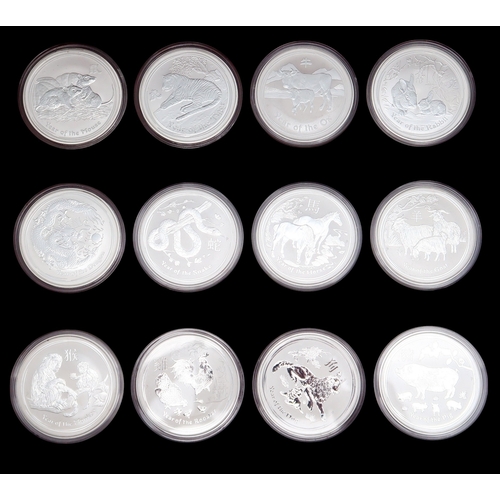 379 - Various Chinese zodiac silver coins with three collector's cases approximate weight 1200 grams