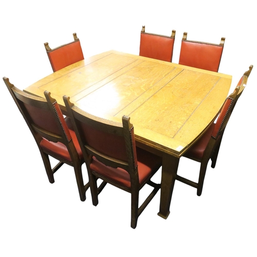 1 - An early 20th century blonde oak arts & crafts style dining suite consisting extending pull out ... 