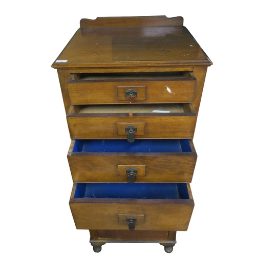 11 - An early 20th century mahogany Art Deco tall boy chest of drawers with six graduating drawers on cab... 