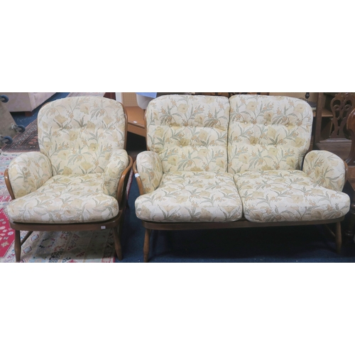 113 - A mid 20th century elm and beech Ercol Windsor suite consisting two seater settee, 81cm high x 140cm... 