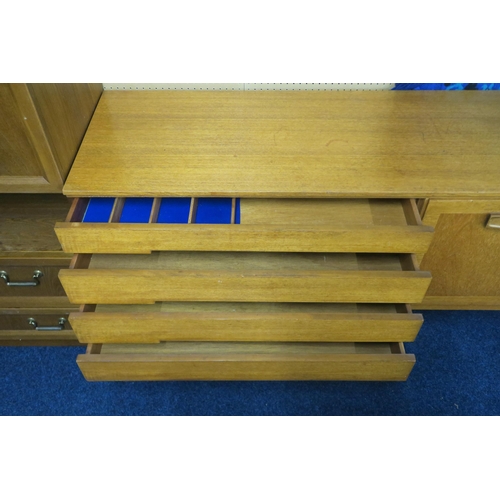 55 - A mid 20th century teak Beautility sideboard with pair of cabinet doors, fall front drinks compartme... 