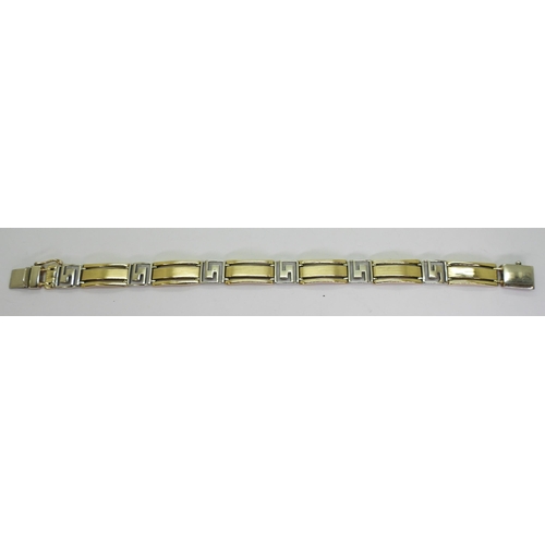 738 - A 9ct yellow and white gold bracelet, length 21cm, weight 22.2gms